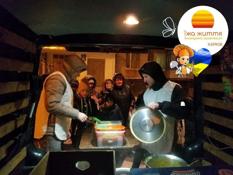 Volunteers distribute food